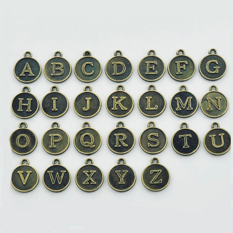 BRONZE LETTER CHARM