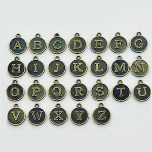 BRONZE LETTER CHARM
